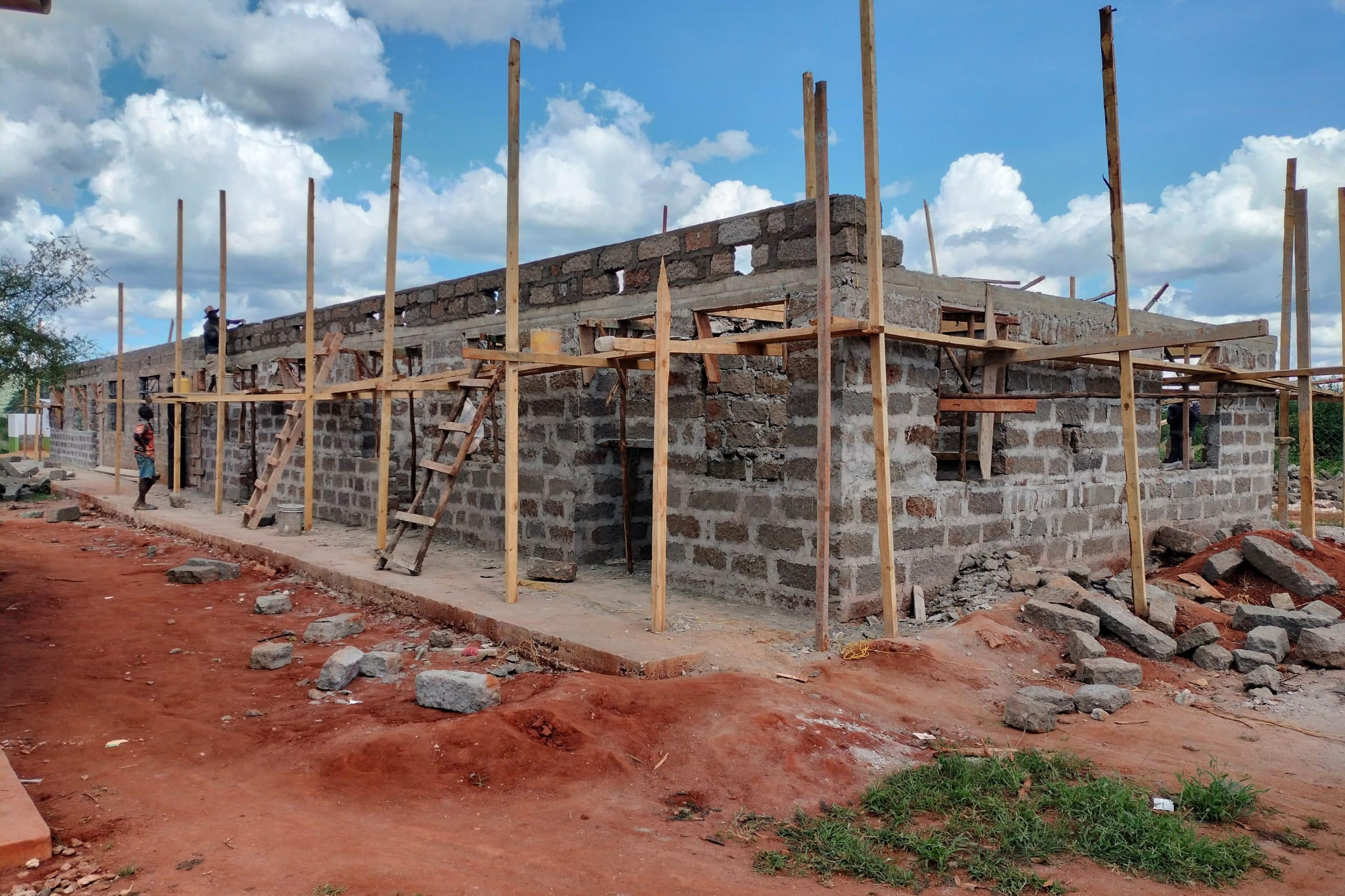 Building under construction without a roof, with wooden scaffolding